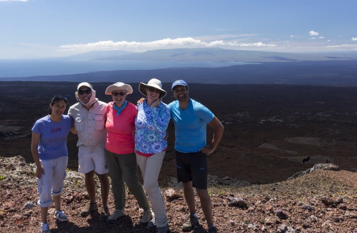 Group of people at the top of a volcano in the Galapagos Islands