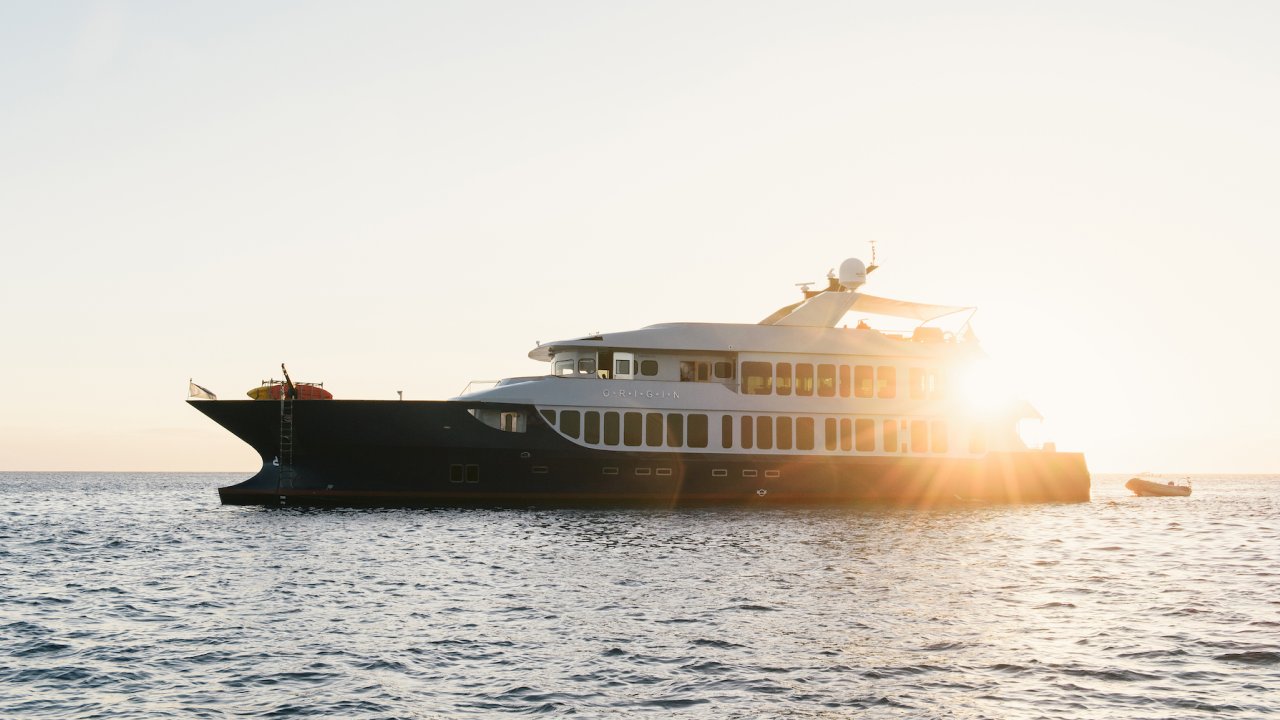 Galapagos yacht on the water at sunset