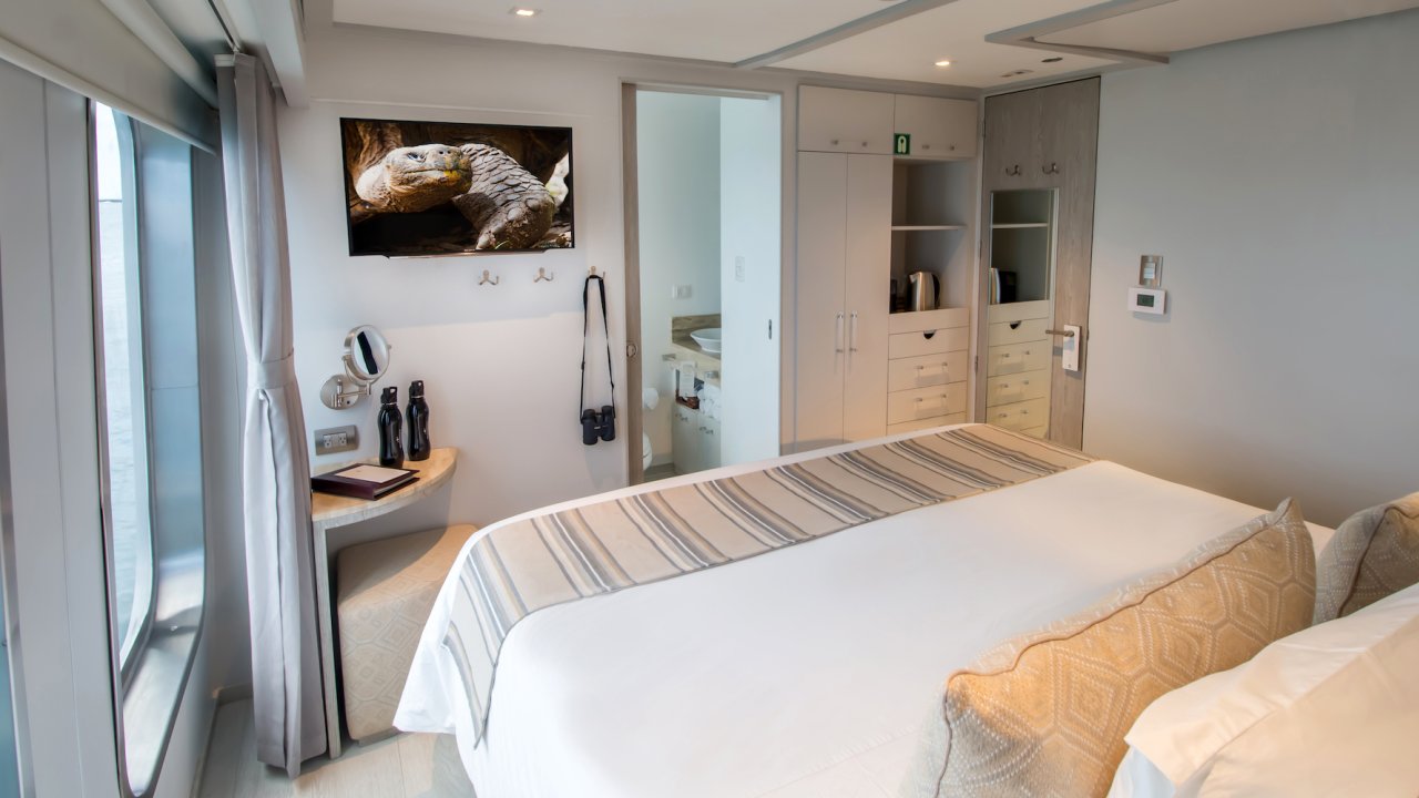 Queen bed stateroom cabin on a luxury yacht in South America