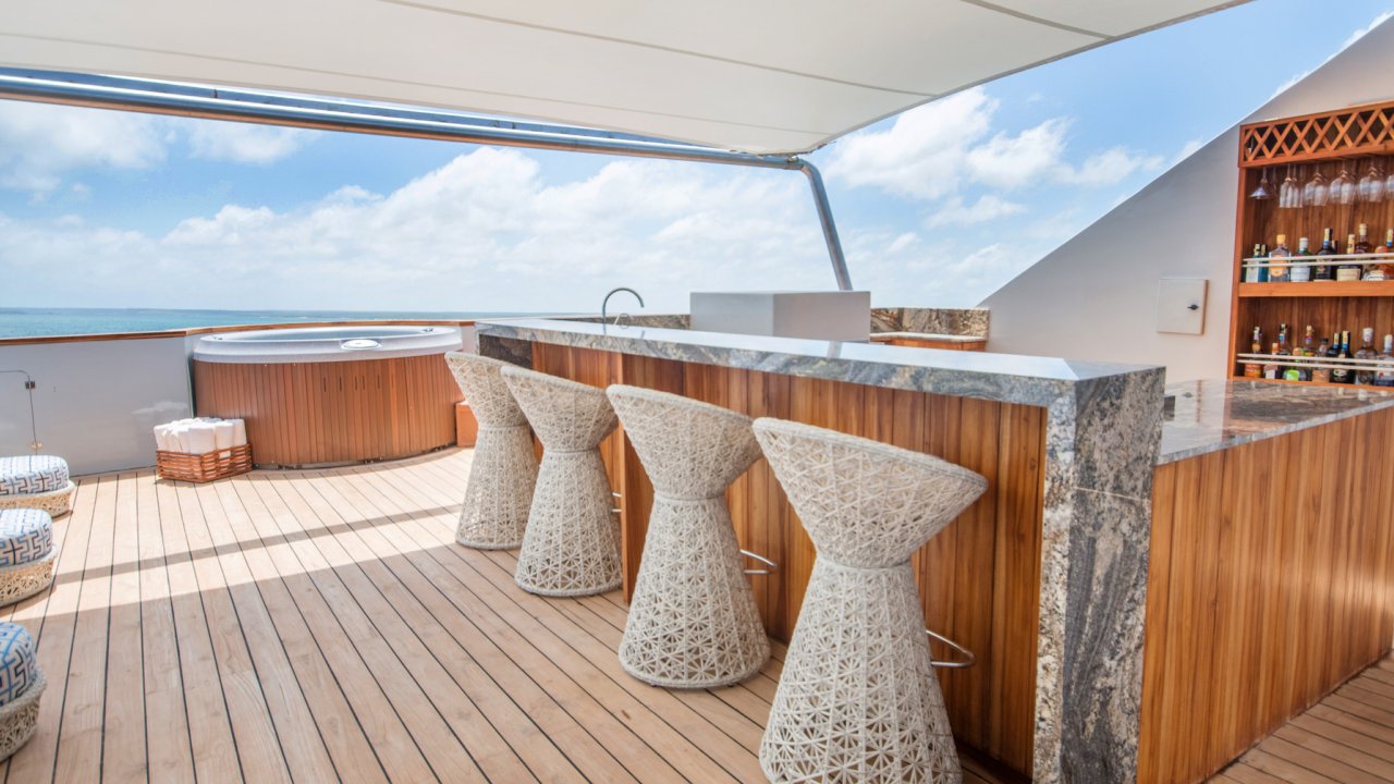 Sundeck and bar on a luxury yacht in the Galapagos on a sunny day
