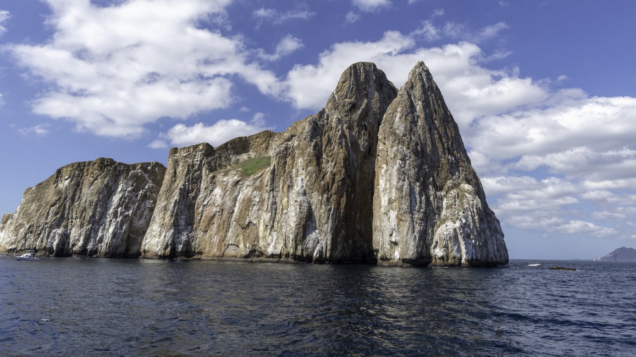 Large rock formation in the middle of the ocean off the coast of the Galapagos Islands