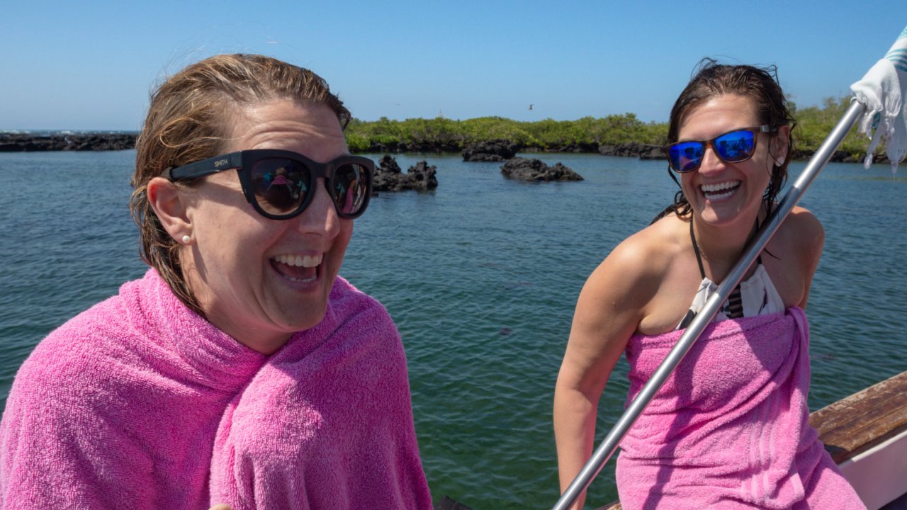 women drying off in galapagos islands