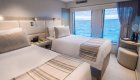 Two twin beds in a luxury cabin on a yacht