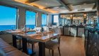 Luxury yacht empty indoor dining room at sunset